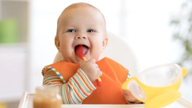 happy baby eating meal