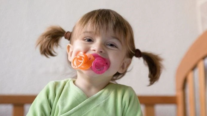 Baby with Pacifier in her mouth