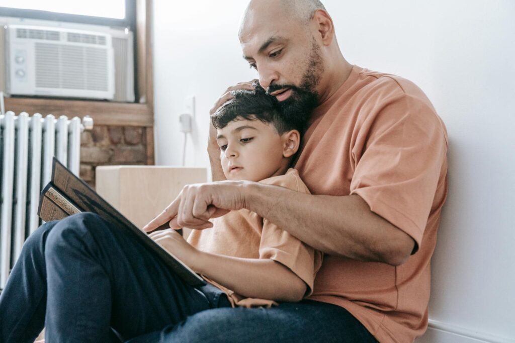 Parent reading with a child at home while comparing phonics learning options